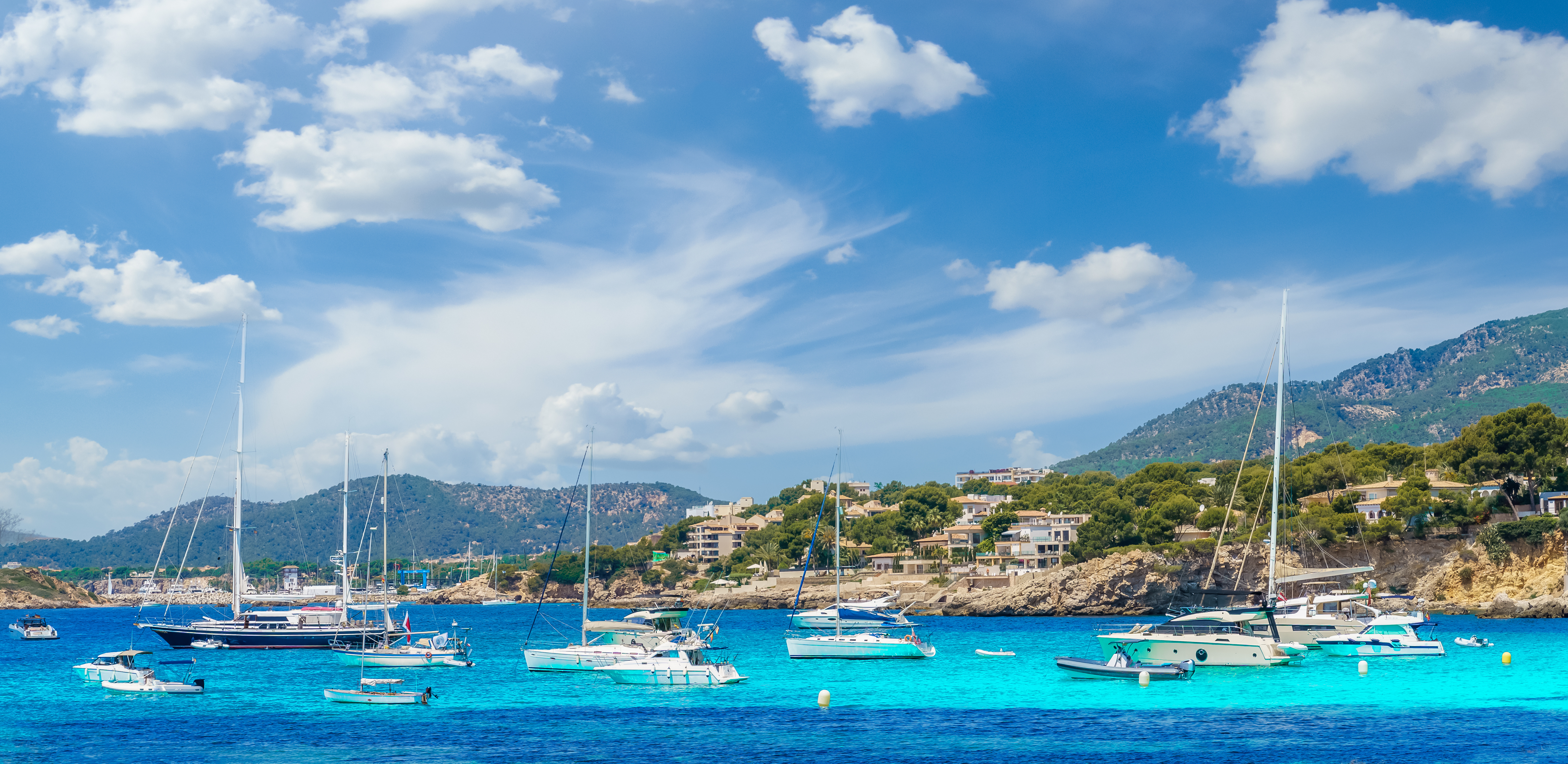 Sailboats anchored off the coast of Illetas