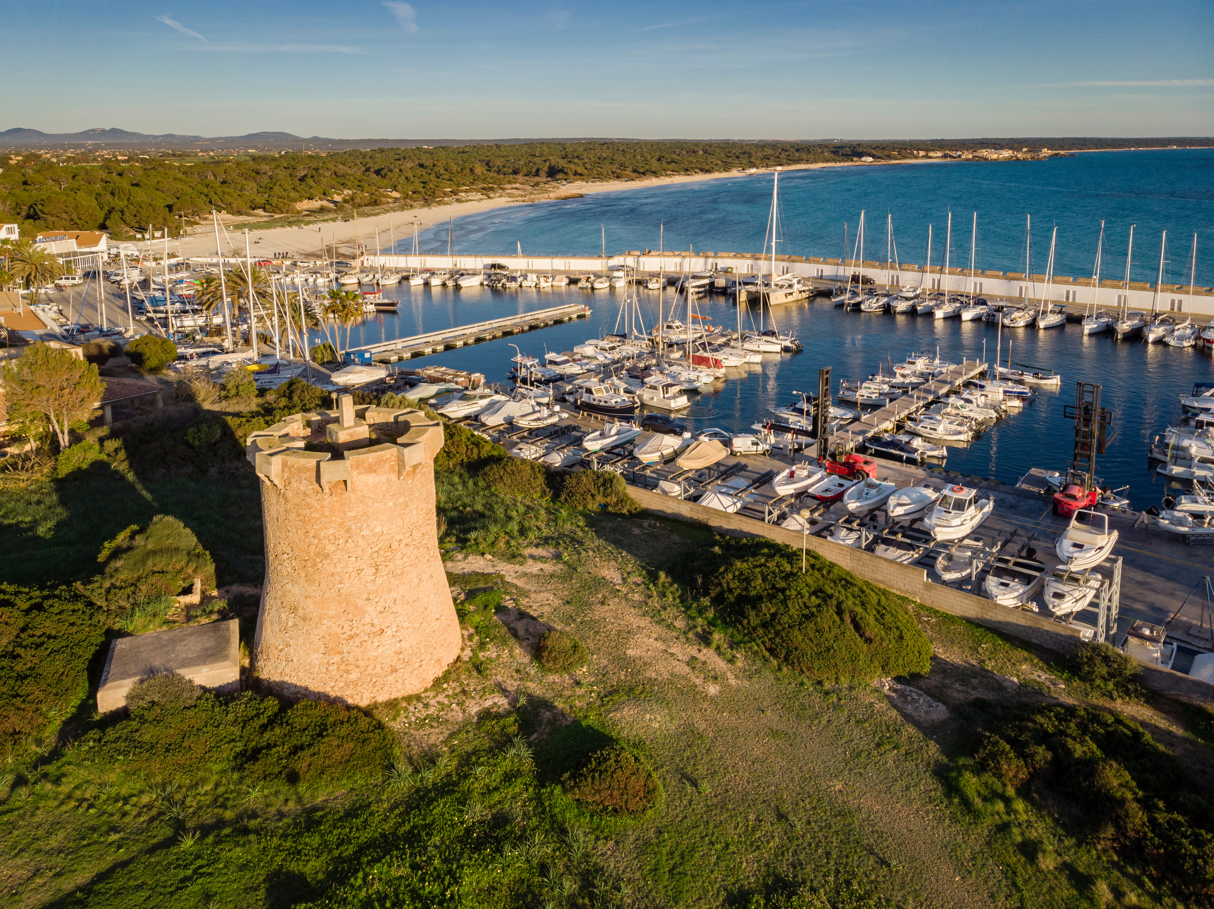 Small marina in Sa Rapita, with the famous Es Trenc in the background