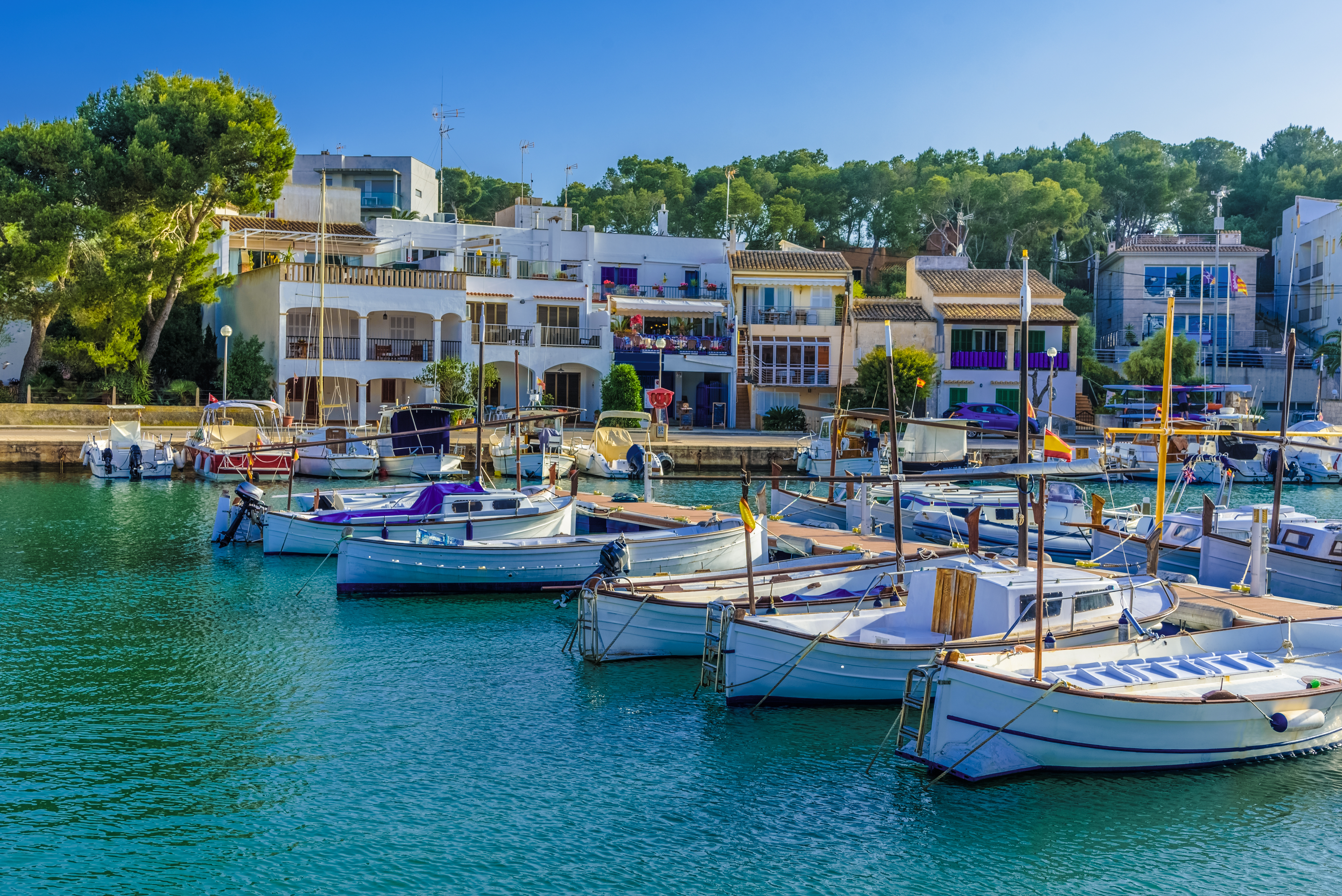 Bright sunshine over the harbor of Porto Petro