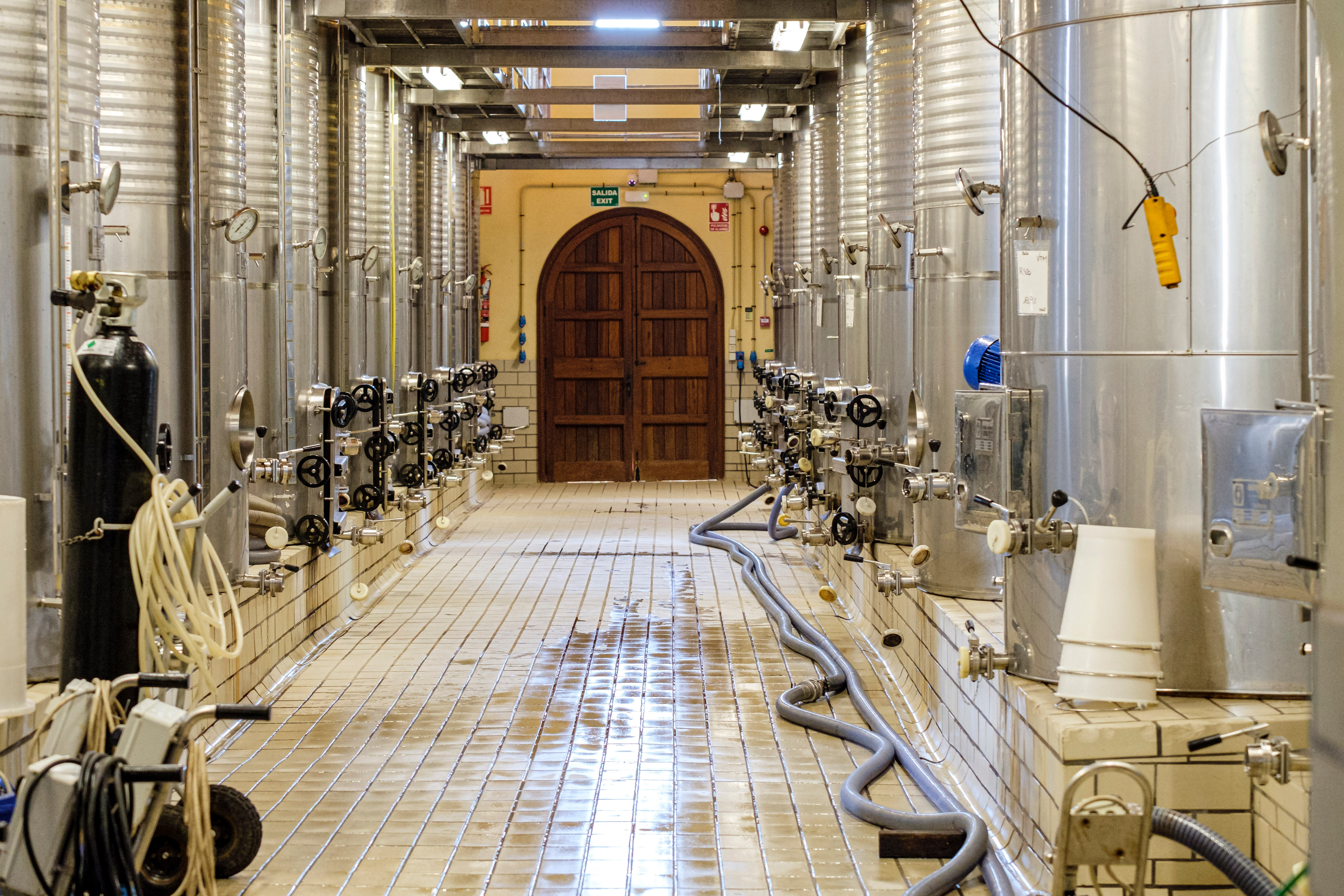 Shiny stainless steel in the modern winery of Santa Maria del Cami